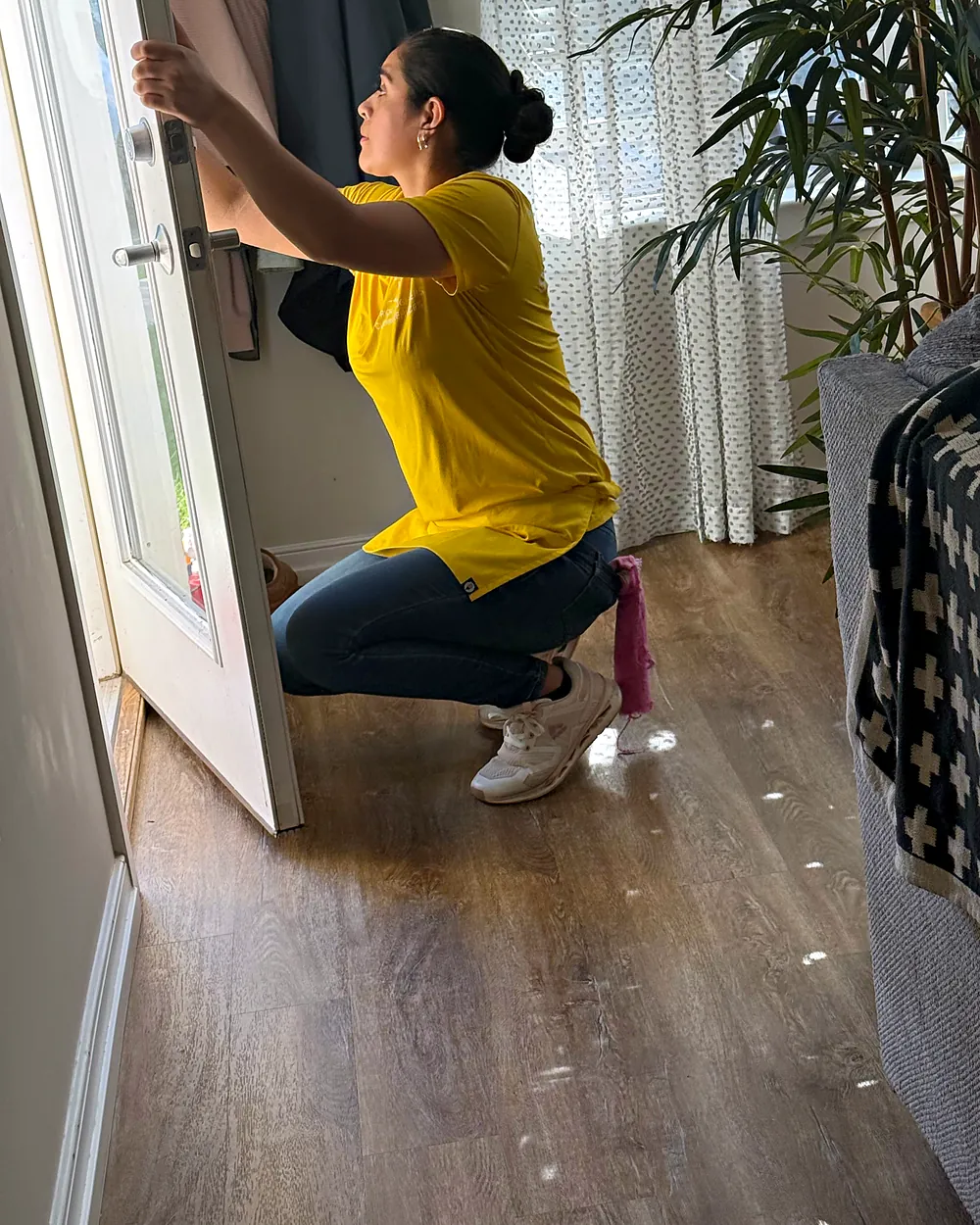 Cleaner detailing a door frame, house cleaning in Chester, NJ