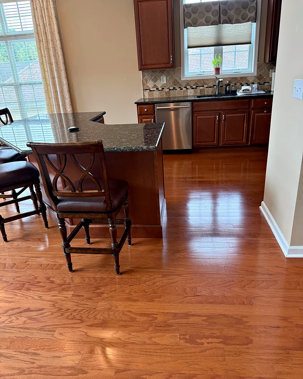 Dining area and kitchen with hardwood floors, house cleaning in Chester, NJ
