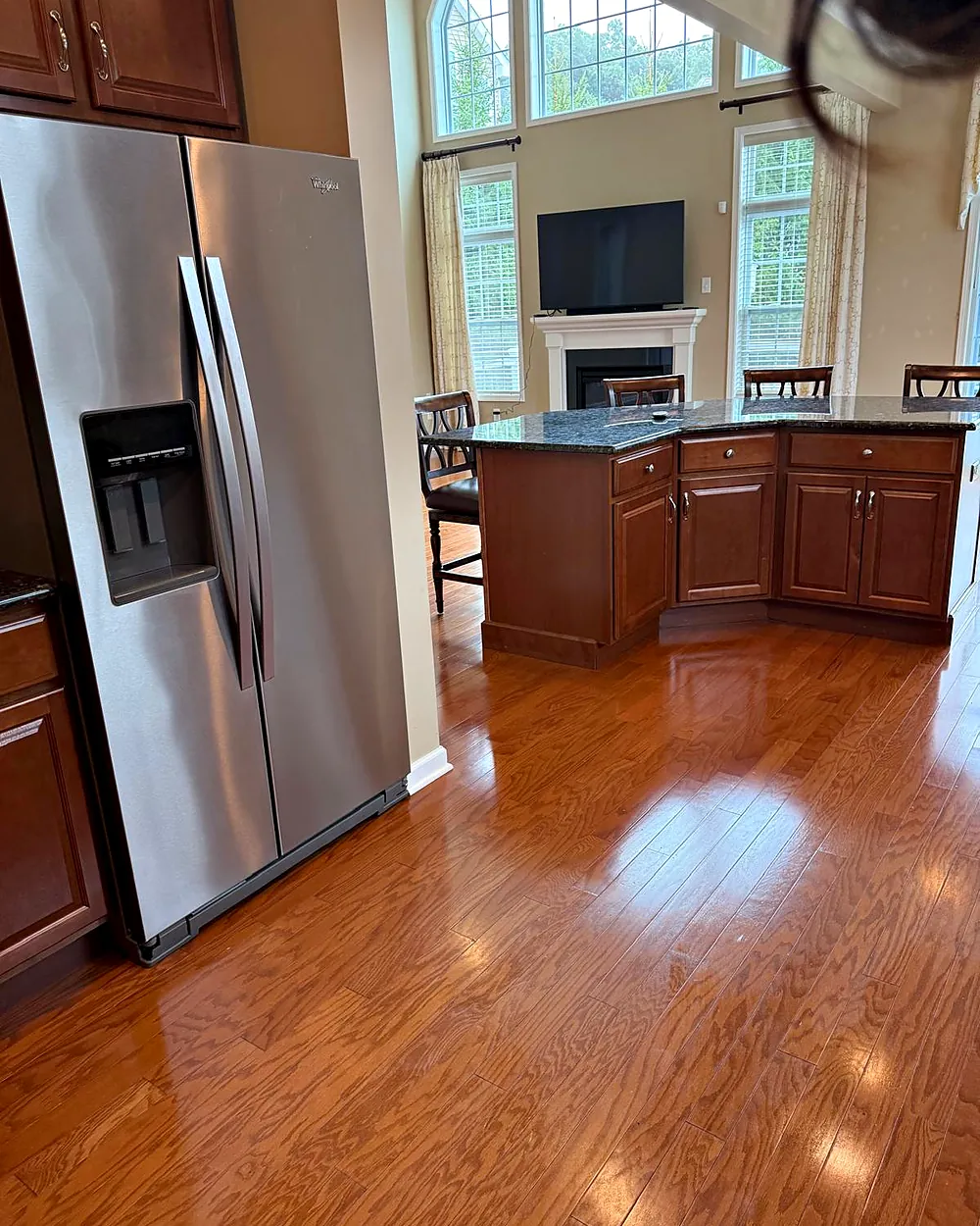 Kitchen with stainless refrigerator and island, house cleaning in Dover, NJ