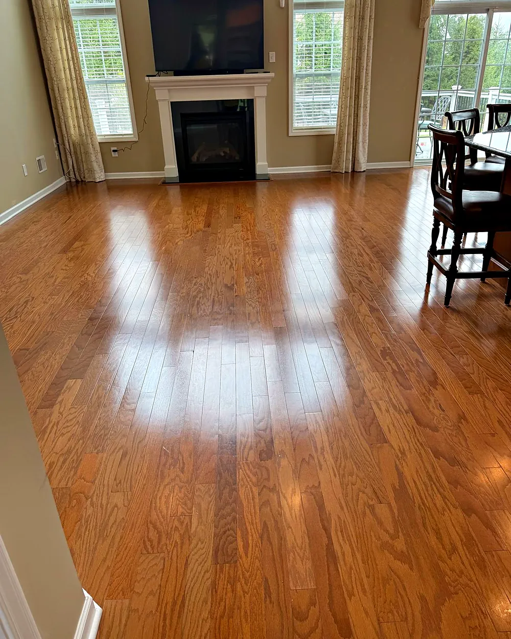 Living room with fireplace and hardwood floors, house cleaning in Dover, NJ