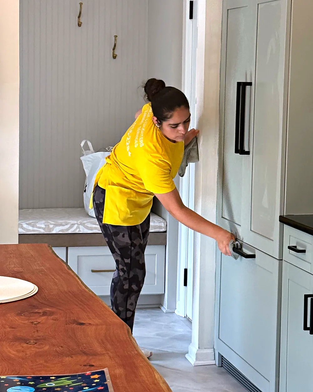 Cleaner wiping bathroom cabinets, house cleaning in Kinnelon, NJ