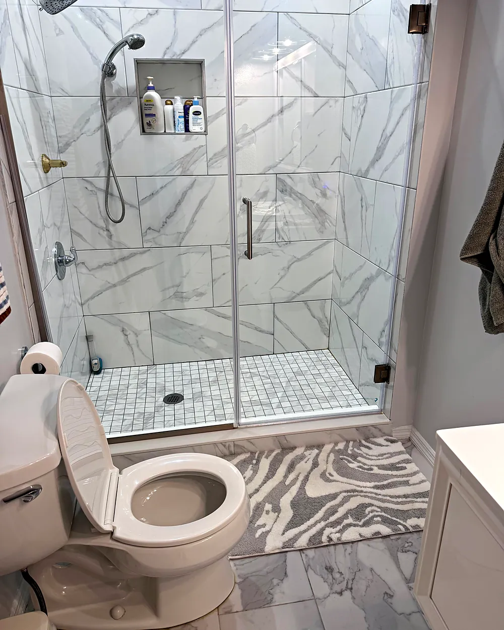 Glass shower with marble tile, house cleaning in Morristown, NJ