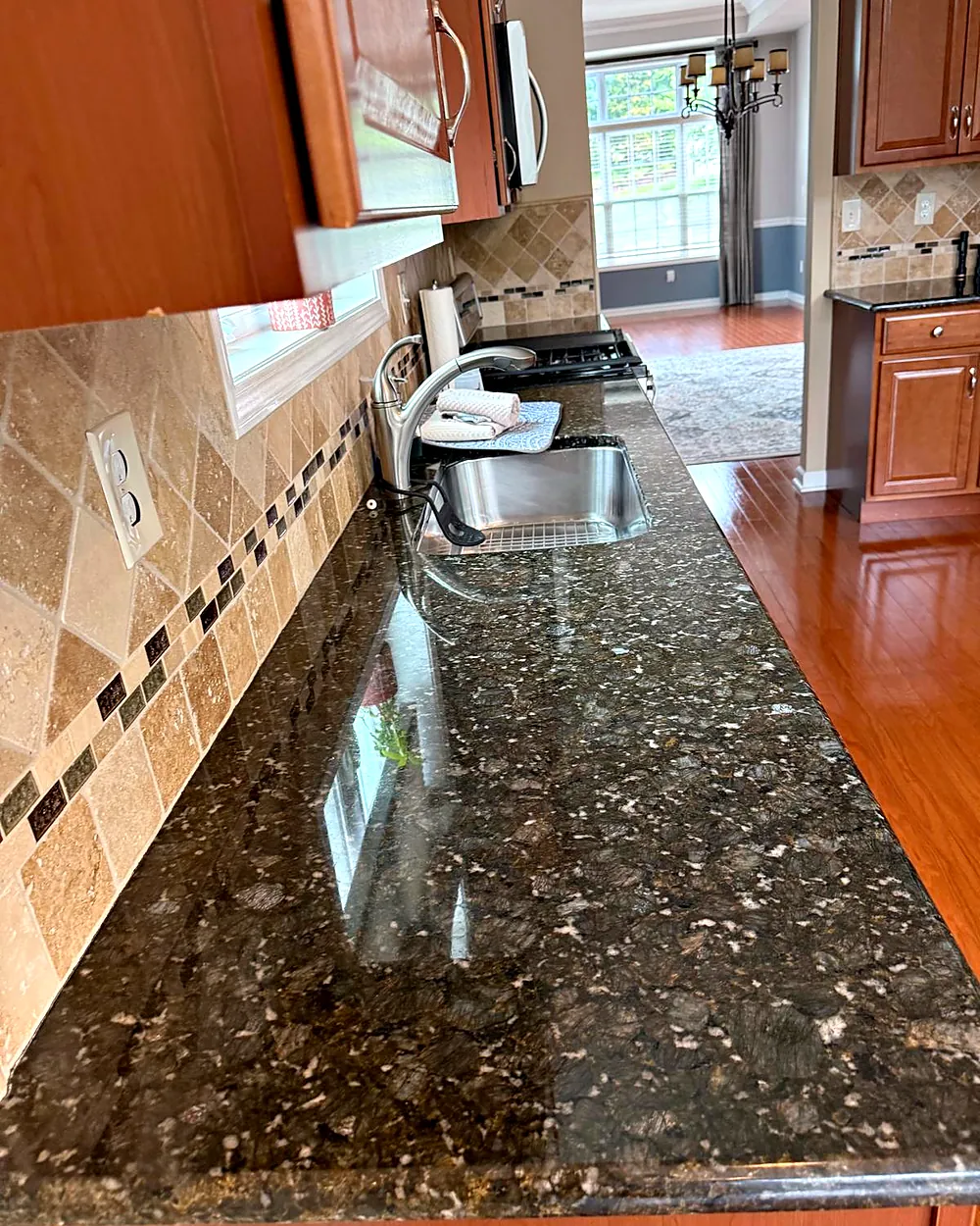 Granite countertop and tile backsplash, house cleaning in Mountain Lakes, NJ