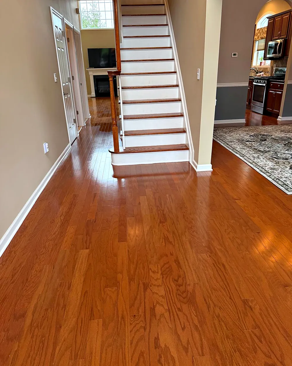 Staircase and hallway with polished hardwood floors, house cleaning in Rockaway, NJ