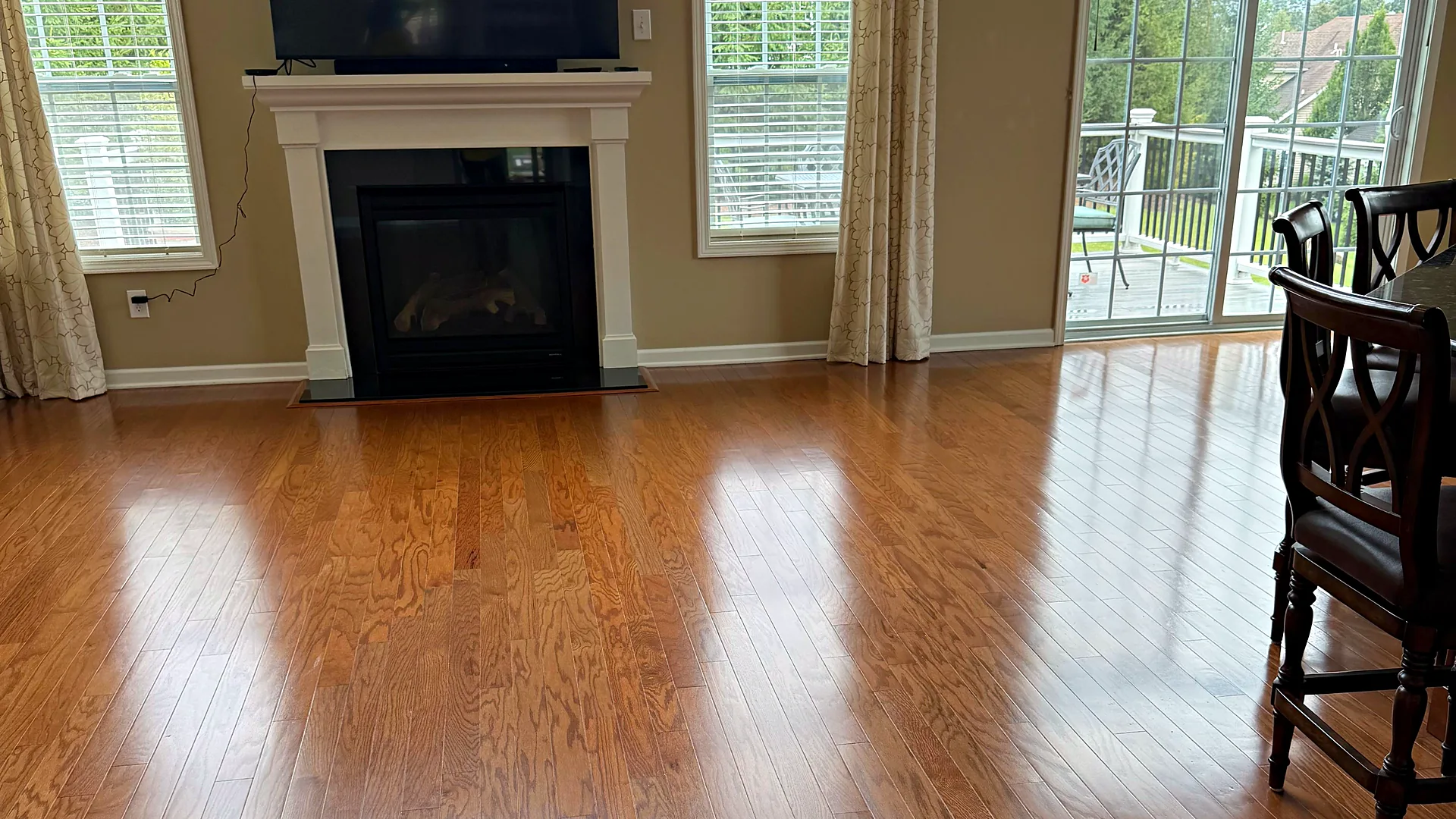 Living room with fireplace and shining hardwood floors, house cleaning in Mountain Lakes, NJ
