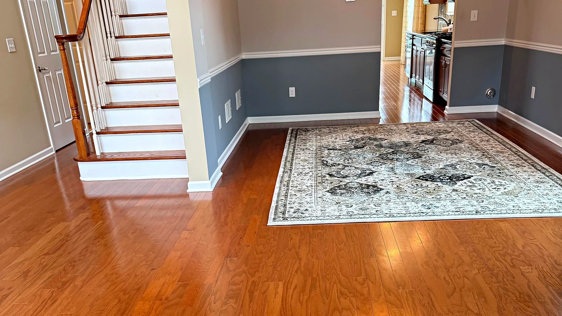 Entryway with staircase and gleaming hardwood floors, house cleaning in Rockaway, NJ