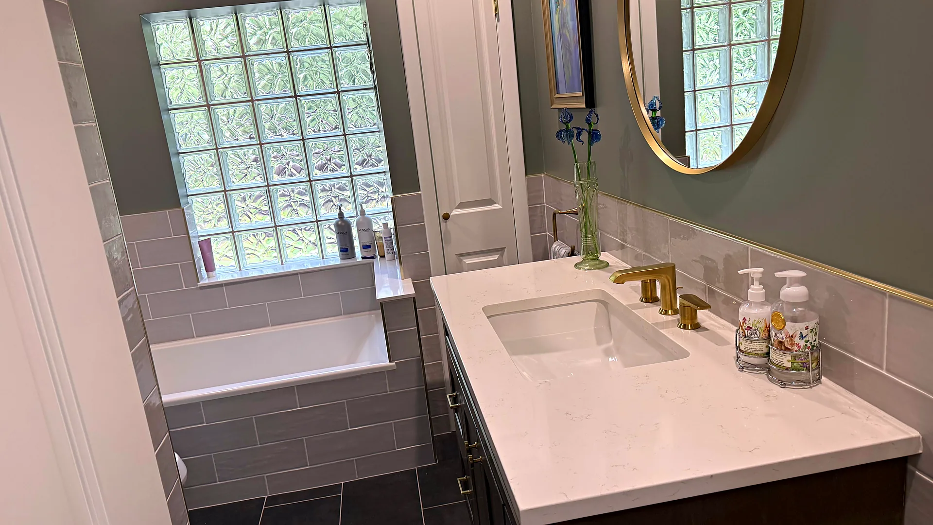Bright bathroom with glass-block window, house cleaning in Sparta, NJ